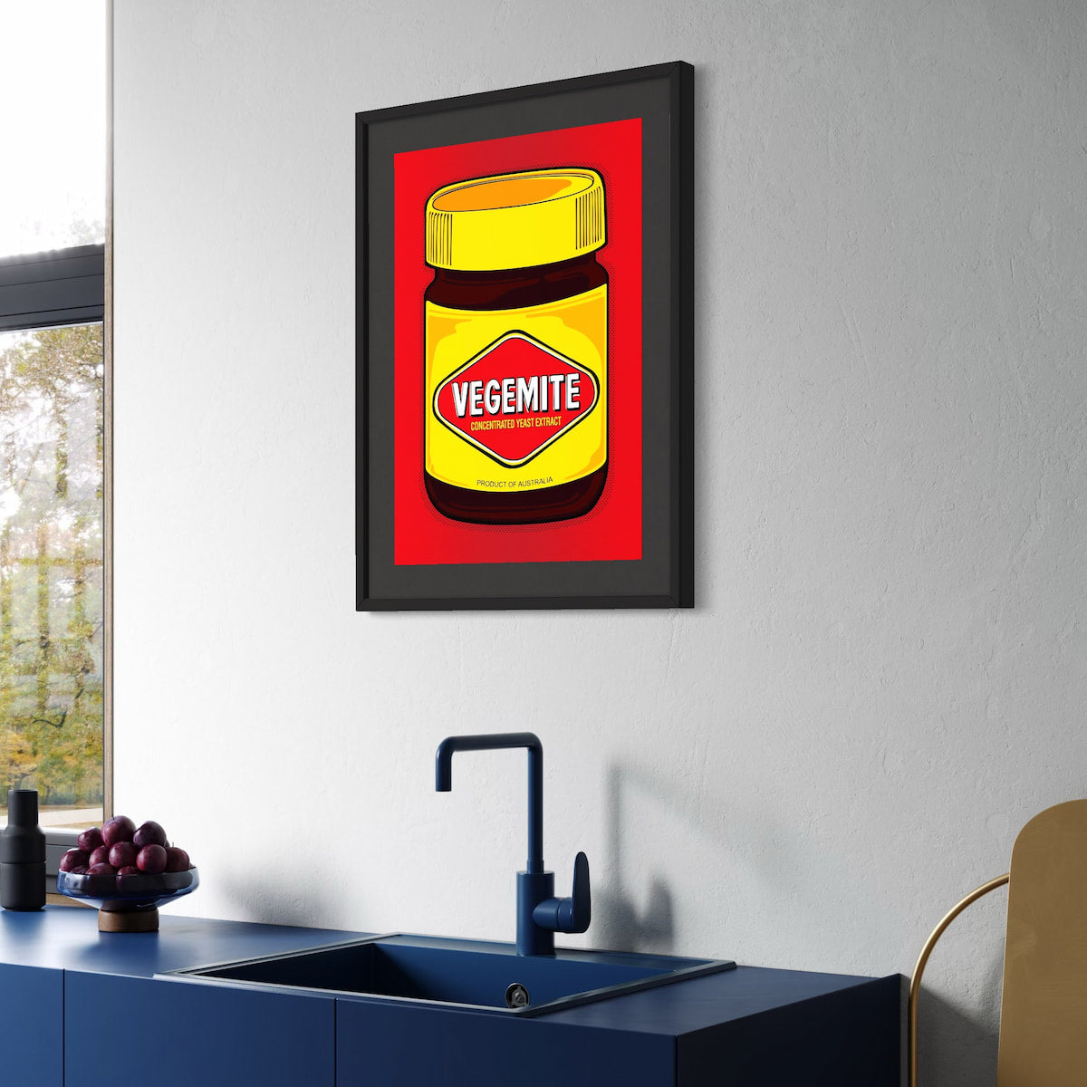 Vegemite in full pop—yellow lid, red diamond, and Aussie pride dialed to eleven. A2 giclée from Nessy Pop Art, framed above a blue kitchen counter by the sink. A national icon styled for the modern pantry.