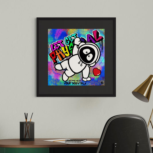 Framed colorful artwork of Hoodie Boy dancing to Let's Get Physical on a wall above a desk.