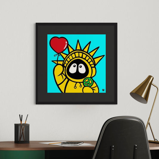 Framed colorful artwork of Hoodie Boy resembling the Statue of Liberty holding a heart and peace symbol on a wall above a desk.