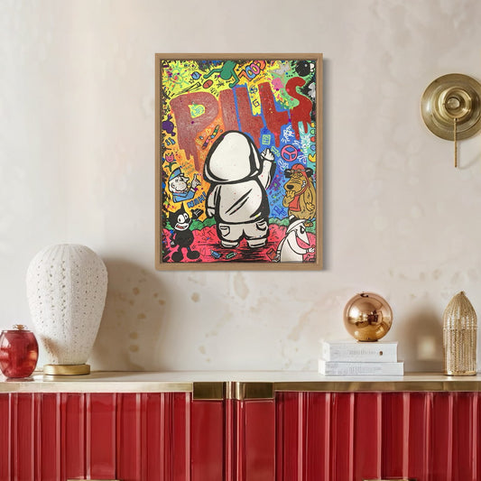 Colorful artwork of Hoodie Boy spray painting the word 'PILLS' with various characters and text on a wall above a red cabinet with decorative items.