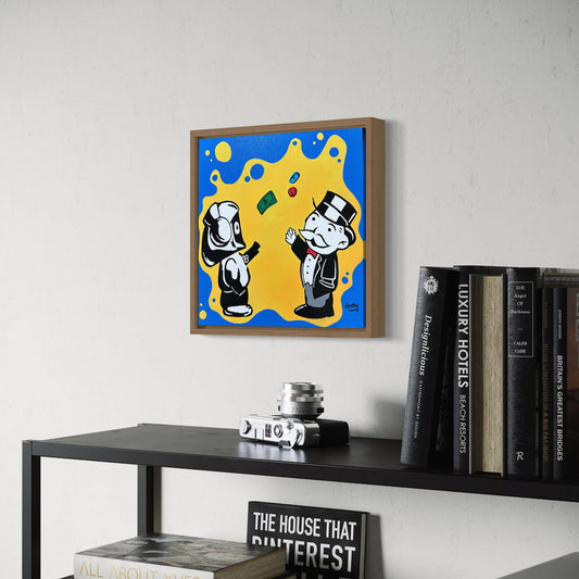 Framed artwork with Hoodie Boy and The Monopoly Man on a wall above a shelf with books and decor items.