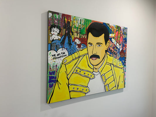 Colorful mixed media artwork of Freddie Mercury in a yellow jacket on a gray wall