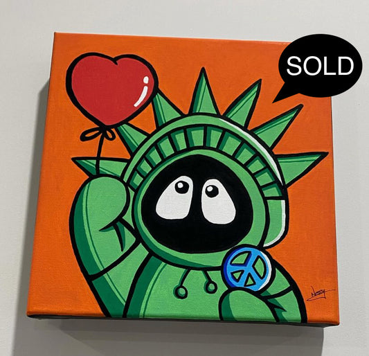 Painting of Hoodie Boy as the Statue of Liberty with a heart balloon and peace symbol, with an orange background, labeled 'SOLD'.