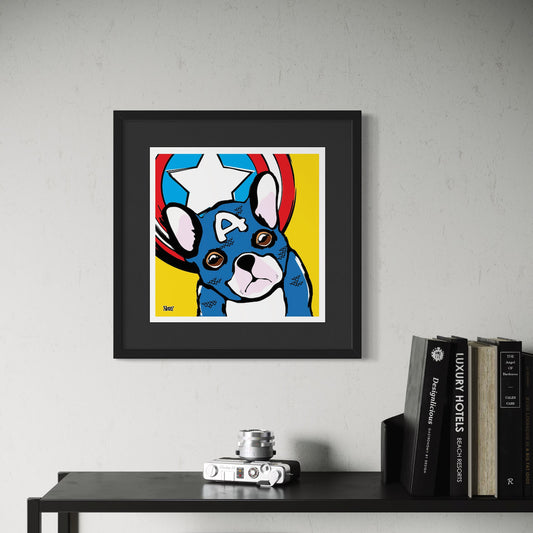Framed artwork of a blue dog dressed as Captain America on a yellow background, displayed on a shelf.