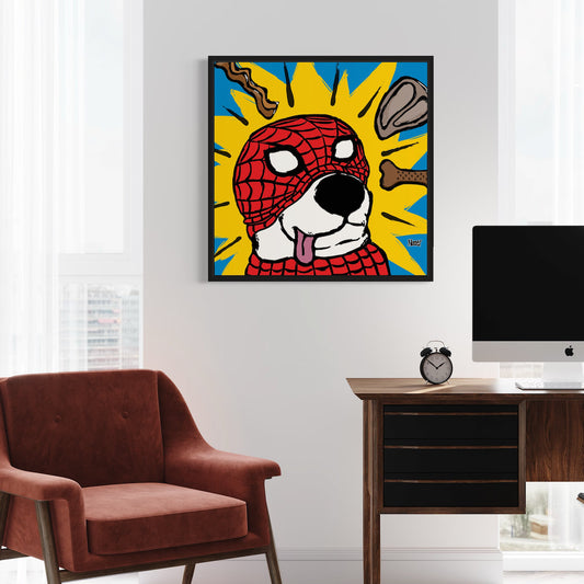 Colorful framed artwork of a dog wearing a Spider-Man mask in a room with a chair and desk.