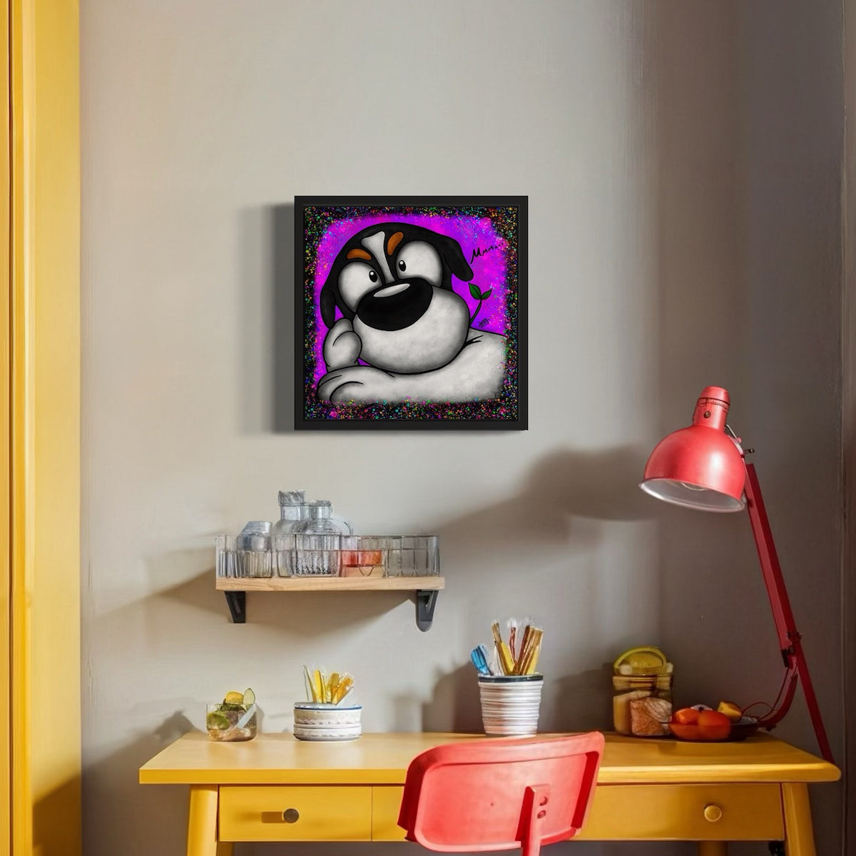 Framed artwork of a cartoon dog in deep contemplation with a purple and black speckled background, on a wall above a desk with a red chair and lamp.