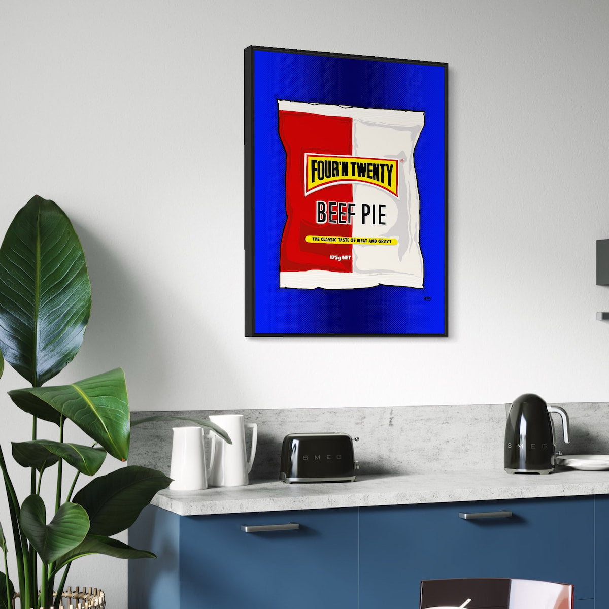 Framed artwork of a Four N Twenty Beef Pie package on a kitchen wall.