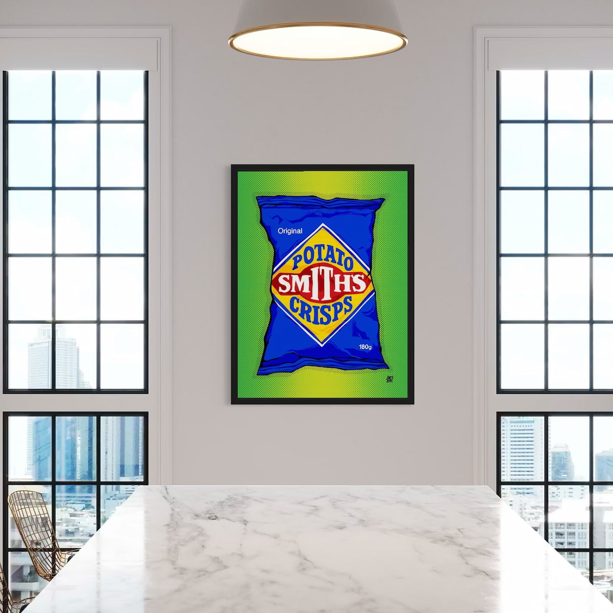 Framed artwork of a Potato Smiths crisps packet on a wall in a room with large windows.
