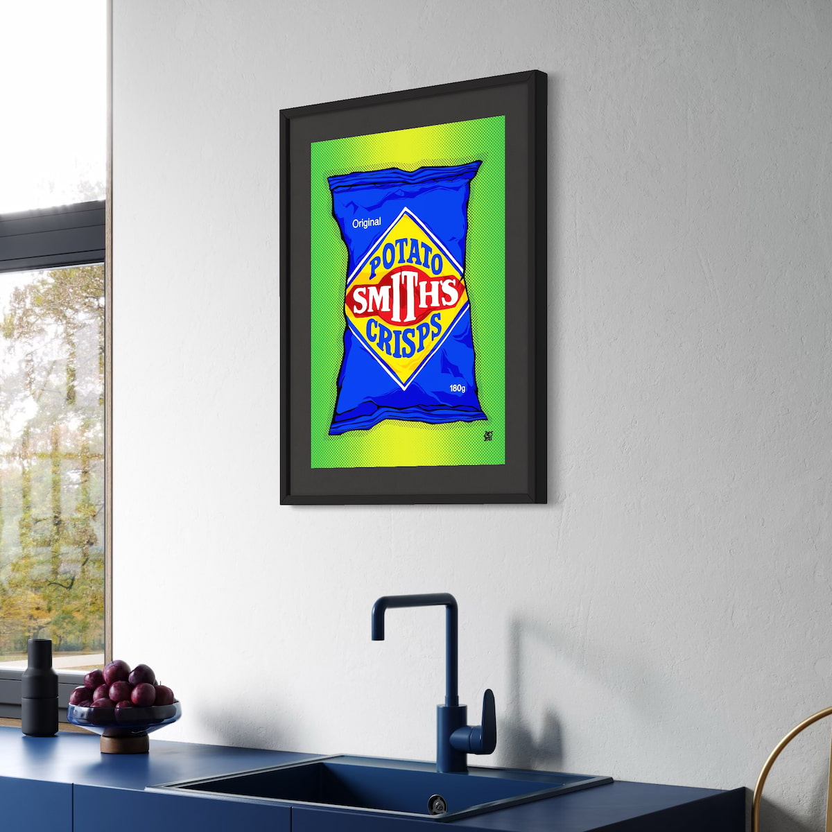 Framed artwork of a Smith's crisps packet on a kitchen wall