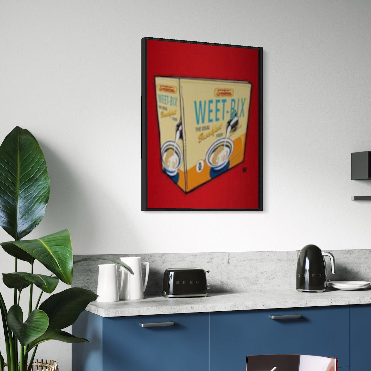 Framed artwork of a Weet-Bix cereal box in a modern kitchen.