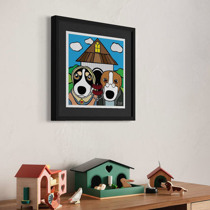 Two dogs in front of triangular-roofed house—playful cartoon homage to American Gothic with expressive faces, blue sky, and yellow window. Staged above shelf of colorful house-shaped decor and animal figurines. Giclée print, 30x30cm from Nessy Pop Art