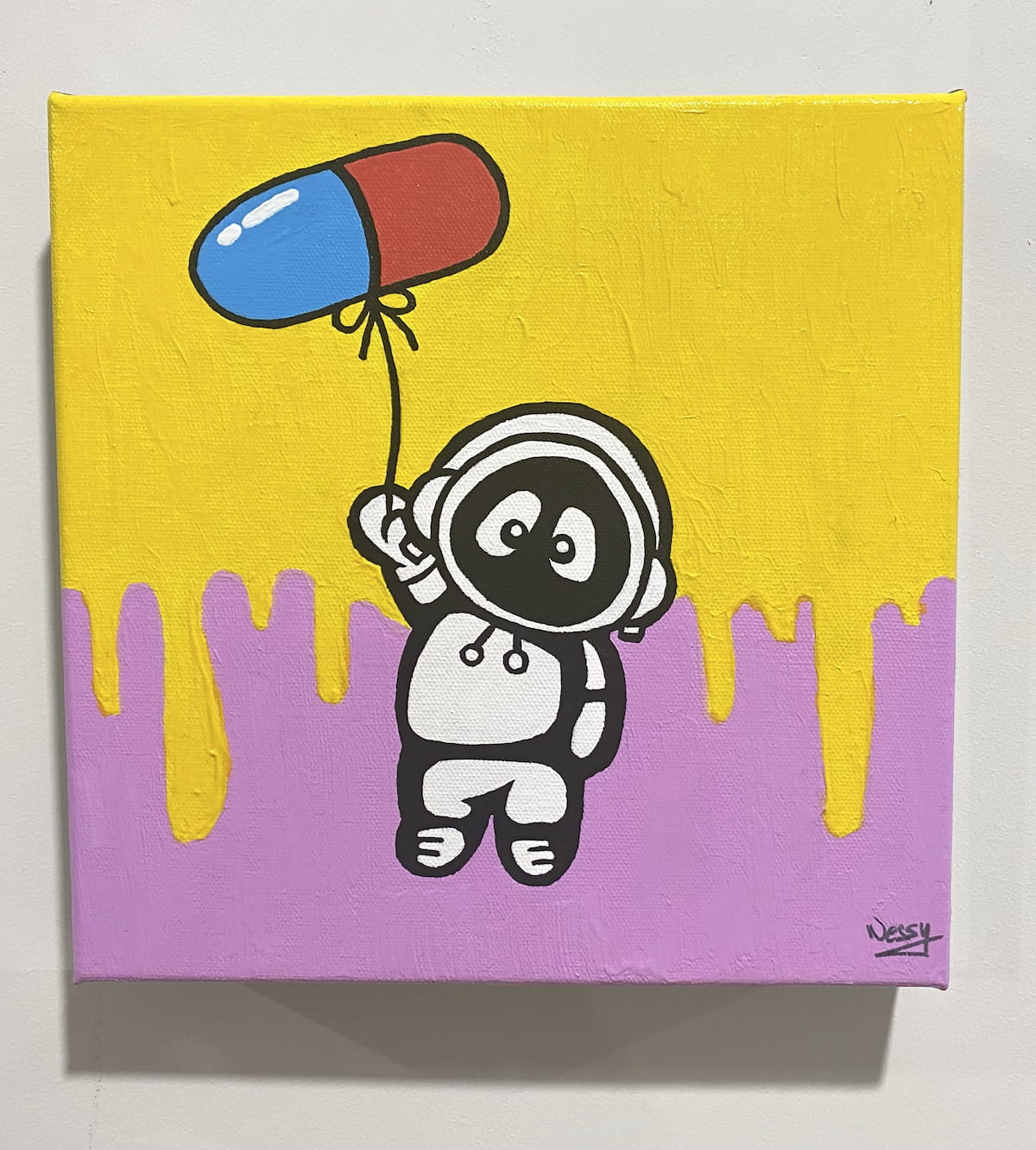 A colorful painting of Hoodie Boy being lifted up by a balloon in the shape of a pill.
