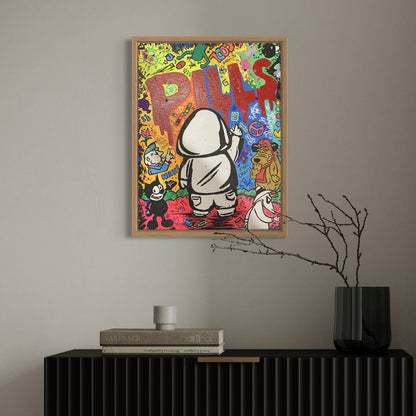 Colorful artwork of Hoodie Boy spray painting the word 'PILLS' with various characters and text on a wall above a black cabinet.