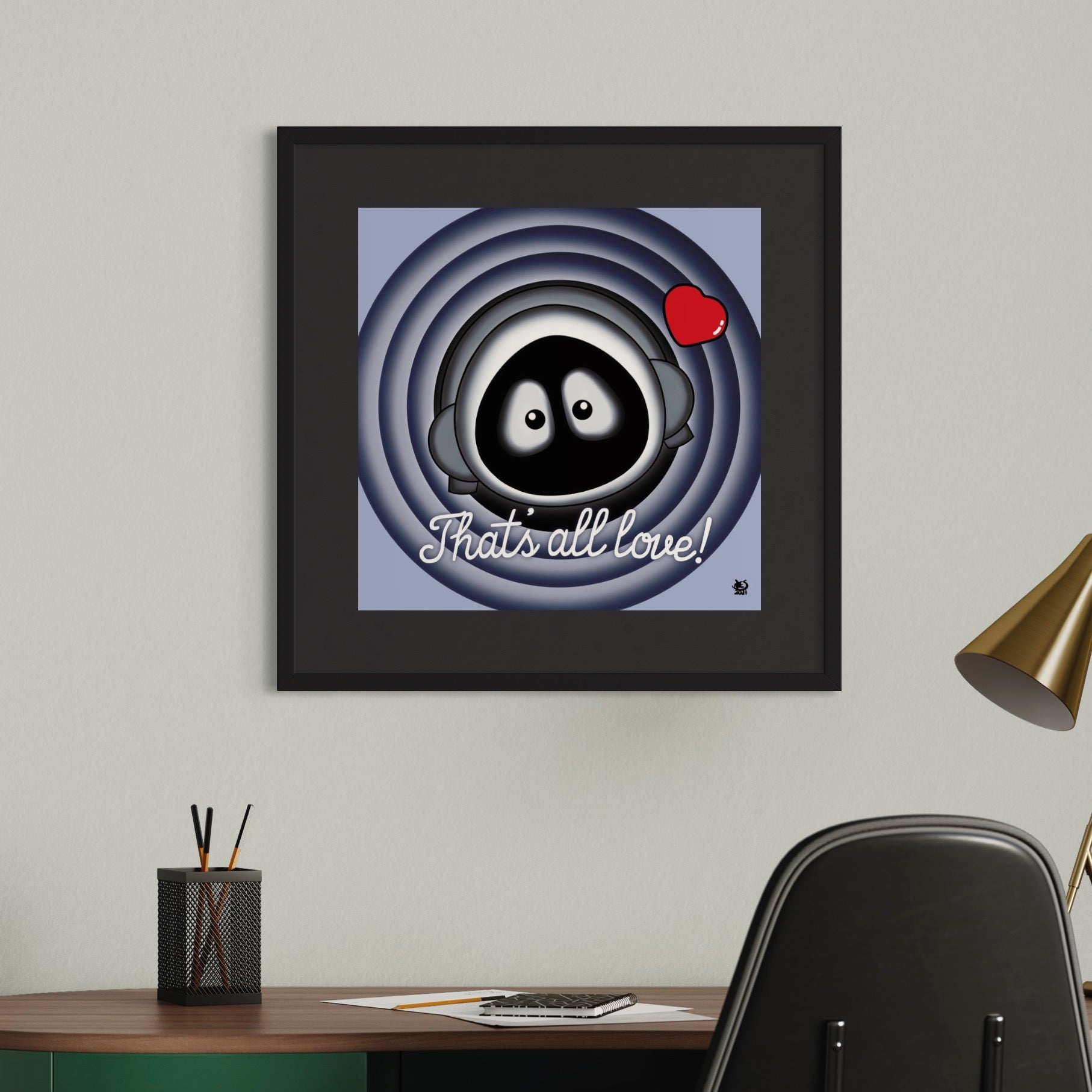 Framed artwork of Hoodie Boy mimicking the end of Bugs Bunny cartoons 'That's all folks!' on a wall above a desk.