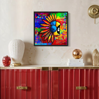 Colorful abstract artwork with Hoodie Boy in an Indian headdress and text  on a wall above a red cabinet with decorative items.