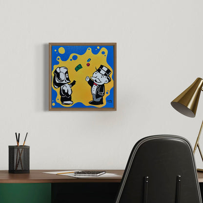 Framed artwork with Hoodie Boy and The Monopoly Man on a blue and yellow background above a desk.