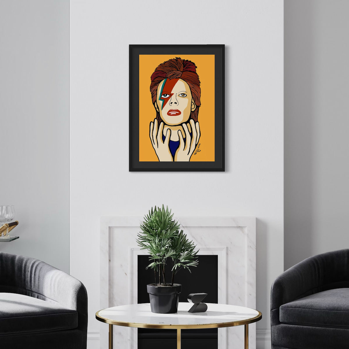 Framed artwork of David Bowie on an orange background in a living room setting.