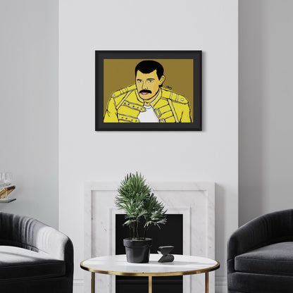 Framed portrait of Freddie Mercury in a yellow jacket on a wall above a round table with a plant.