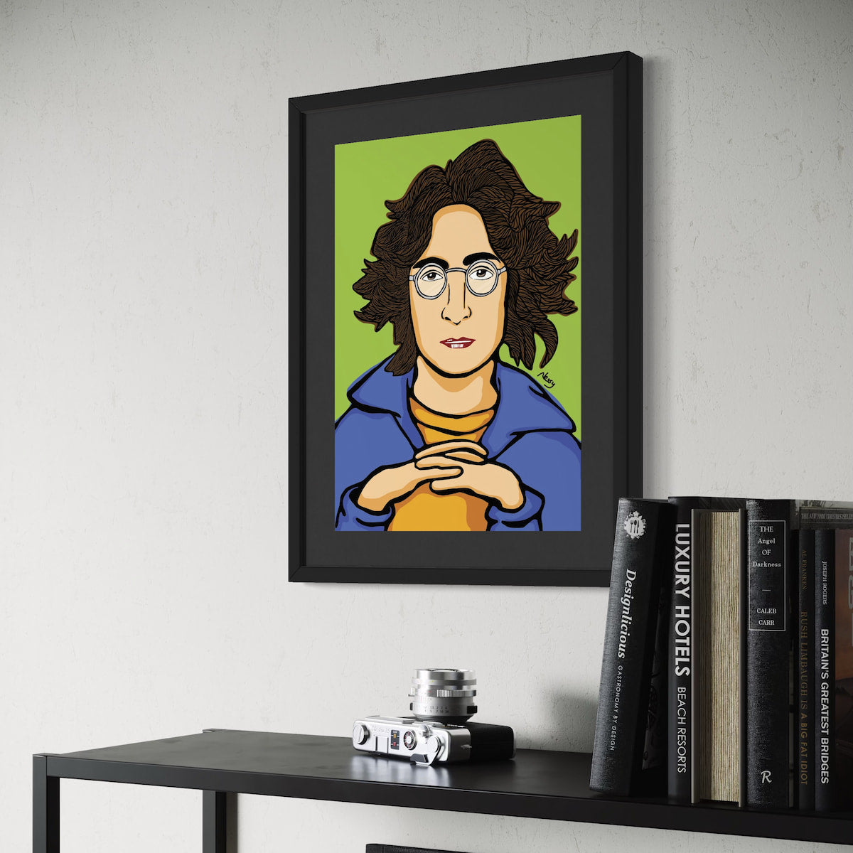 Stylized cartoon portrait of John Lennon—wavy brown hair, round glasses, blue jacket, and yellow shirt, hands clasped against soft green backdrop. Giclée print, A3 from Nessy Pop Art