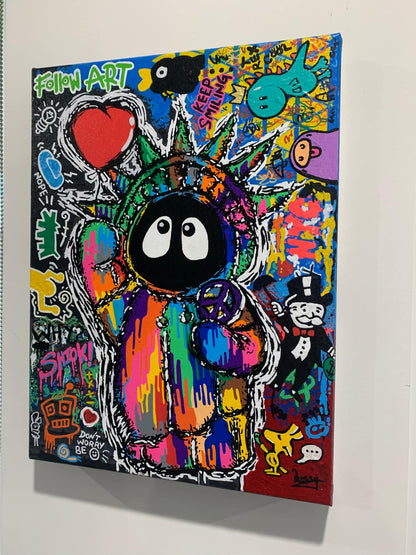 Colorful painting depicting Hoodie Boy as the Statue of Liberty with a heart balloon and peace symbol surrounded by iconic images. viewed on the side on a white wall.