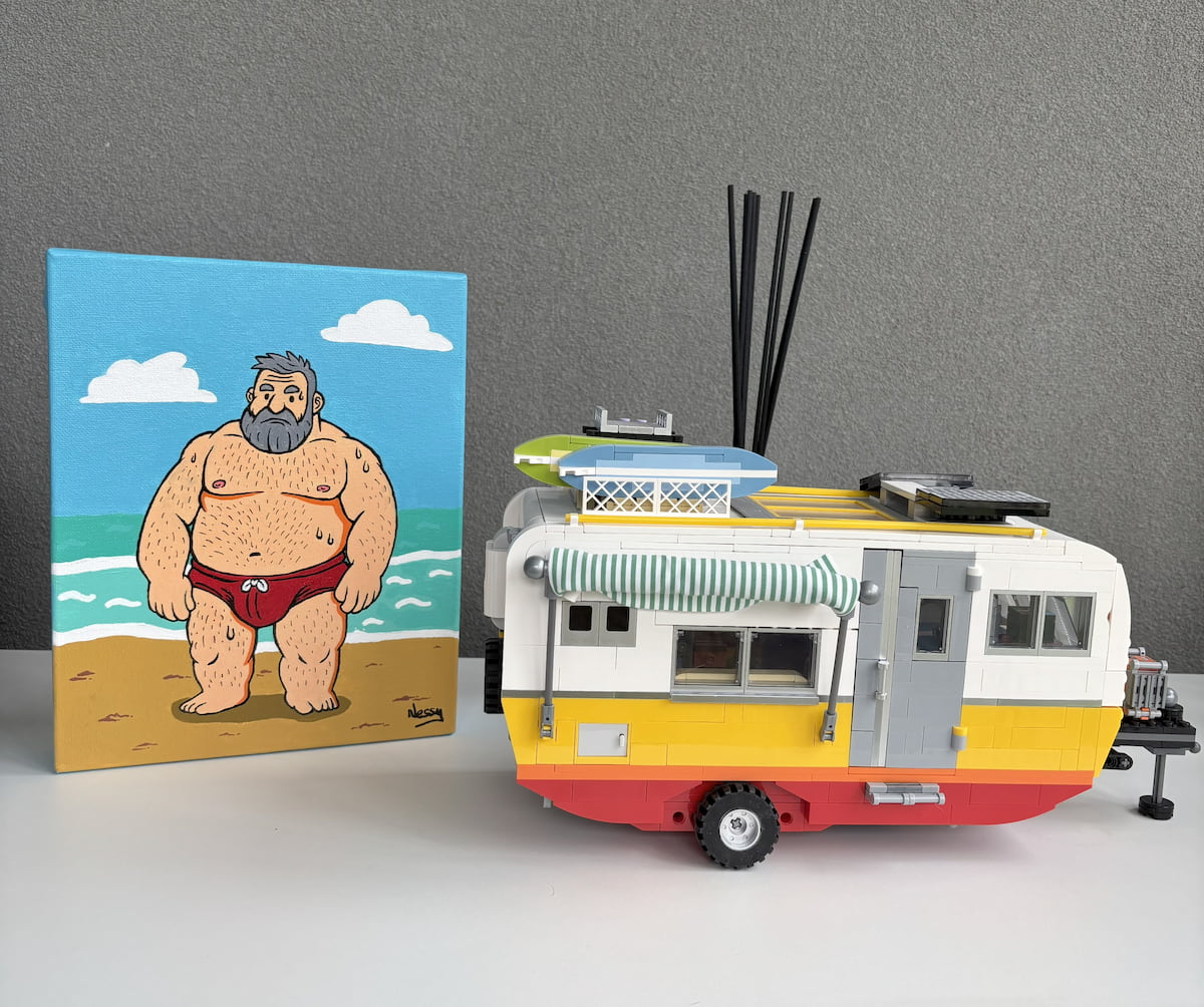 Beach brute meets camper chic—cartoon canvas of silver-bearded figure in red speedo paired with LEGO-style trailer, staged against neutral wall. Acrylic canvas, 8x10in from Nessy Pop Art.
