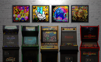 Collection of vintage arcade machines against a brick wall with framed retro gaming artwork above.