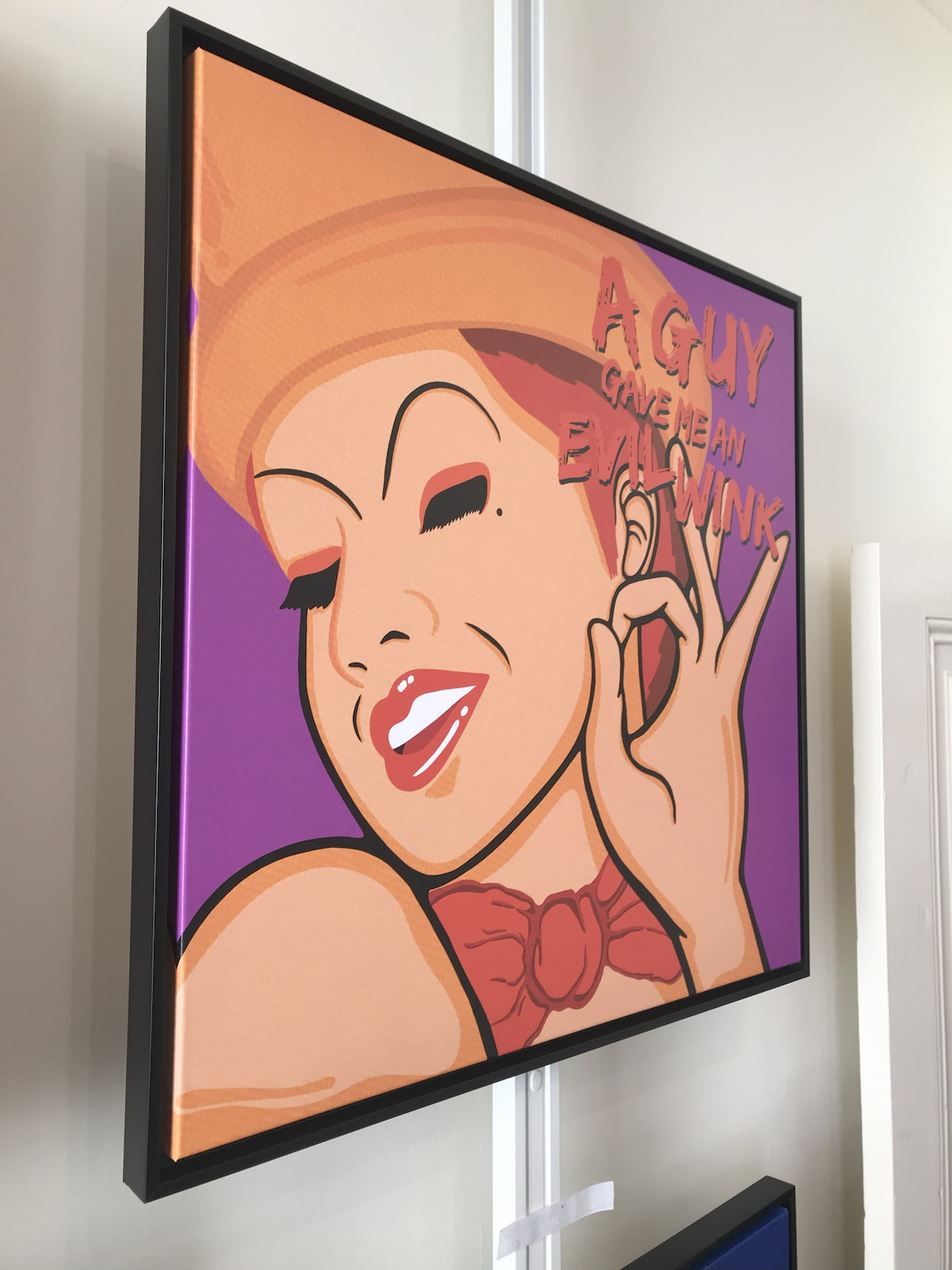 Framed artwork of Columbia from Rocky Horror with text on a purple background