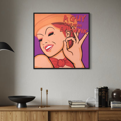 Framed artwork of Columbia from Rocky Horror with text on a wall above a wooden shelf.