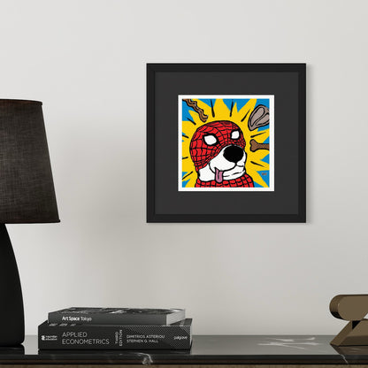 Framed artwork of a cartoon dog with a superhero mask on a wall above books.